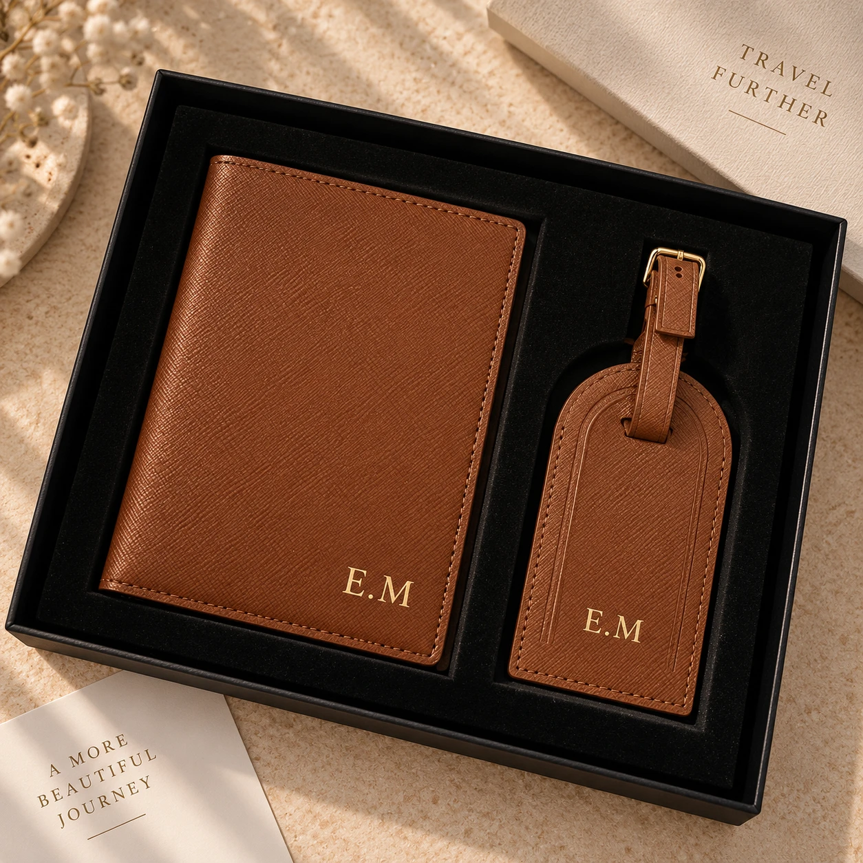 Tan passport cover and luggage tag presented in a gift box